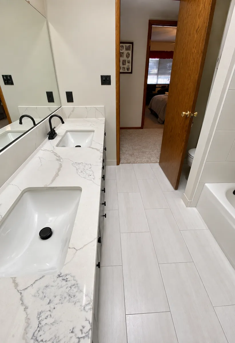 White quartz double vanity in a remodeled Clovis bathroom